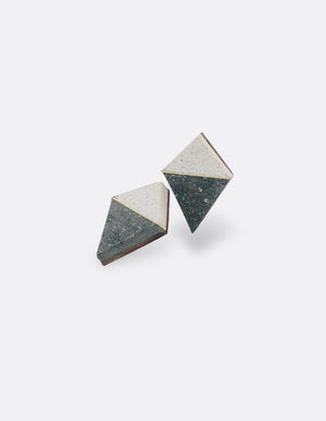 Yomo Studio black & white rhombus earrings. Materials include: concrete, brass, and walnut wood.