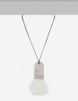 81 Dots in the Clouds Necklace This Yomo Studio cloud collection necklace is made of: concrete, brass, organic wool, and wax string.