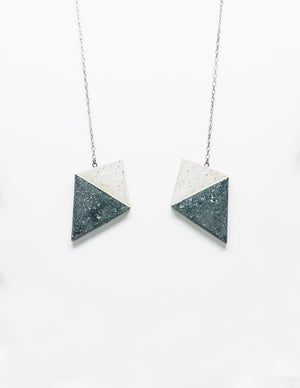 Yomo Studio concrete heart necklace. Materials include: concrete, brass, and silver chain.