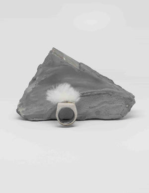 Yomo Studio cloudy ring in grey. Materials include: concrete, brass, and organic wool.